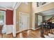 Open foyer featuring hardwood floors, natural light, and a staircase at 625 Jefferson Pl, Cumming, GA 30040