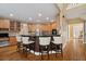 Kitchen featuring a breakfast bar, stainless appliances and granite countertops at 625 Jefferson Pl, Cumming, GA 30040