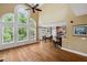 Bright living room features hardwood floors, cathedral ceilings and breakfast bar at 625 Jefferson Pl, Cumming, GA 30040