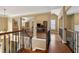 A view of the open floor plan and railings from the second-story loft area at 625 Jefferson Pl, Cumming, GA 30040