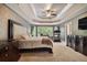 Spacious main bedroom with a trey ceiling, sitting area, and ensuite bath at 625 Jefferson Pl, Cumming, GA 30040