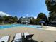 Community pool featuring lap lanes, splash pad and plenty of lounging area at 625 Jefferson Pl, Cumming, GA 30040