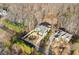 Stunning aerial view of a luxury home, showcasing its private lot and manicured landscaping at 1355 Cashiers Way, Roswell, GA 30075