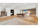 Spacious finished basement with a bar, billiards table, and staircase to another floor at 1355 Cashiers Way, Roswell, GA 30075