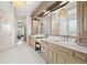 Bright bathroom features a separate shower, and double vanity with marble countertops at 1355 Cashiers Way, Roswell, GA 30075