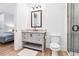 Bathroom featuring marble countertop vanity, modern fixtures, and a glass enclosed shower at 1355 Cashiers Way, Roswell, GA 30075
