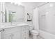 This bathroom features a tub with shower and bright white vanity with chrome fixtures at 1355 Cashiers Way, Roswell, GA 30075