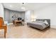 Spacious bedroom with wood floors, a desk and shelving, plus an ensuite bathroom at 1355 Cashiers Way, Roswell, GA 30075