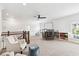 Bright upstairs bonus room with a ceiling fan and large play area at 1355 Cashiers Way, Roswell, GA 30075