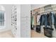 The walk-in closet includes custom shelving and storage, providing ample space for clothes and accessories at 1355 Cashiers Way, Roswell, GA 30075