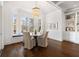 Charming dining area with bay window, elegant lighting, and built-in cabinetry at 1355 Cashiers Way, Roswell, GA 30075