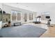 Bright home gym featuring rubber flooring, multiple windows, and exercise equipment at 1355 Cashiers Way, Roswell, GA 30075