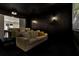 Home theater with dark walls, theater seating, projector, and an adjacent room at 1355 Cashiers Way, Roswell, GA 30075