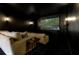 Home theater with large screen, projector, comfortable seating, and dark walls at 1355 Cashiers Way, Roswell, GA 30075
