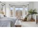 Bright main bedroom with bay windows, sitting area, and neutral decor at 1355 Cashiers Way, Roswell, GA 30075