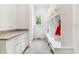 Mudroom featuring built-in cubbies, bench, storage, and a gray countertop at 1355 Cashiers Way, Roswell, GA 30075