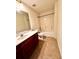This bathroom features tiled floors, a vanity with a single sink, and a shower-tub combination at 3476 Harvest Ridge Ln, Buford, GA 30519