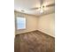 Bedroom with neutral carpet, ceiling fan, and a large window at 3476 Harvest Ridge Ln, Buford, GA 30519