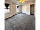 This bedroom features neutral walls, two windows with curtains, and a ceiling fan with an overhead light at 3476 Harvest Ridge Ln, Buford, GA 30519