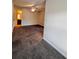 This carpeted bedroom has neutral walls, ceiling fan with light, and an open doorway to a bathroom at 3476 Harvest Ridge Ln, Buford, GA 30519