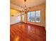 Cozy dining room with hardwood floors, natural light and an elegant chandelier at 3476 Harvest Ridge Ln, Buford, GA 30519