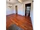 Elegant dining room with hardwood floors, wainscoting, and a decorative chandelier at 3476 Harvest Ridge Ln, Buford, GA 30519