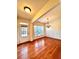 Inviting dining room featuring hardwood floors, wainscoting, and lots of natural light at 3476 Harvest Ridge Ln, Buford, GA 30519