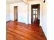 Bright dining area with hardwood flooring and classic white wainscoting detail at 3476 Harvest Ridge Ln, Buford, GA 30519