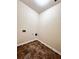 This empty laundry room features vinyl floors and electrical outlets ready for laundry machines at 3476 Harvest Ridge Ln, Buford, GA 30519