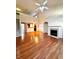Spacious living room featuring hardwood floors, a fireplace, and lots of natural light at 3476 Harvest Ridge Ln, Buford, GA 30519