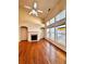 Bright living room with a fireplace, large windows, and vaulted ceilings at 3476 Harvest Ridge Ln, Buford, GA 30519