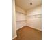 Spacious walk-in closet with built-in wire shelving for optimal storage at 3476 Harvest Ridge Ln, Buford, GA 30519
