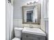 Light and airy bathroom with a gray vanity, a large mirror, and white tiled walls at 1646 Flicker Rd, Jonesboro, GA 30238