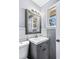 This bathroom features a vanity, mirror, new fixtures and natural light at 1646 Flicker Rd, Jonesboro, GA 30238