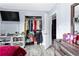 Bedroom with a modern dresser, TV, and open closet at 1646 Flicker Rd, Jonesboro, GA 30238