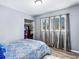 Bedroom showcasing large window with curtains and closet space at 1646 Flicker Rd, Jonesboro, GA 30238