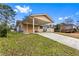 Inviting ranch-style home with covered carport, brick exterior, and well-kept lawn at 1646 Flicker Rd, Jonesboro, GA 30238