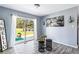 Light-filled sunroom with sliding glass doors leading to a patio and backyard seating area at 1646 Flicker Rd, Jonesboro, GA 30238