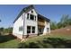 This home has a classic back exterior with a small deck and well-maintained yard at 4435 Beechnut Cir, Cumming, GA 30028