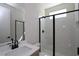 Modern bathroom features glass enclosed shower, white subway tiles, and sleek black fixtures at 4435 Beechnut Cir, Cumming, GA 30028