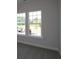 Cozy bedroom featuring two windows, neutral carpet, and fresh paint at 4435 Beechnut Cir, Cumming, GA 30028