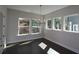 Inviting dining room with modern chandelier, hardwood floors, and multiple windows with natural light at 4435 Beechnut Cir, Cumming, GA 30028
