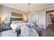 Serene bedroom featuring a cozy sitting area, neutral color palette, and decorative wooden artwork at 2233 Peachtree Ne Rd # 402, Atlanta, GA 30309