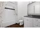 Bathroom features a shower/tub combo with white subway tile and a vanity with storage at 326 S Columbia Dr, Decatur, GA 30030