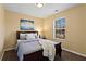 Bedroom featuring a double window, artwork, ceiling fan, and carpet flooring at 392 Fourth St, Forest Park, GA 30297