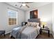 Bedroom with natural light, ceiling fan, Lion artwork, and comfortable bed at 392 Fourth St, Forest Park, GA 30297