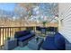 Outdoor deck area featuring comfortable seating, table and bar stools at 392 Fourth St, Forest Park, GA 30297