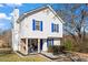 Charming two-story home with white siding and bright blue shutters and a cozy front porch at 392 Fourth St, Forest Park, GA 30297