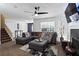 Spacious living room showcasing a comfortable gray sofa, fireplace, and staircase at 392 Fourth St, Forest Park, GA 30297