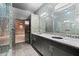 Modern bathroom with double vanity, mosaic tile, and glass-enclosed shower at 434 Marietta Nw St # 301, Atlanta, GA 30313